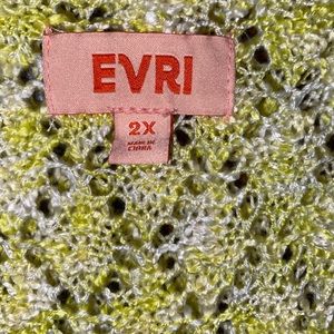 Woman’s yellow and cream sweater